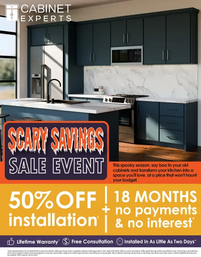 Modern kitchen with dark blue cabinets, marble backsplash, and stainless steel appliances, promoting Cabinet Experts' scary savings sale event offering 50% off installation with financing options